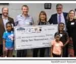 EPIC presents check to Mercy Housing Lakefront
