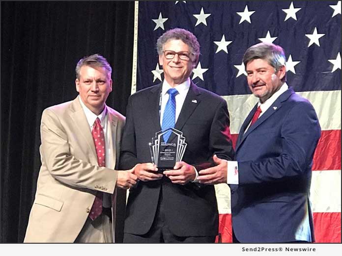 Kenneth Rakusin, President and CEO Gordon Brush (center)