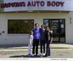 Sam Stiele with his kids and wife Kimberly in front of Hopkins Auto Body