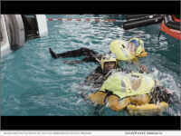 Diver assisting in FMTC's Helicopter Underwater Escape Training