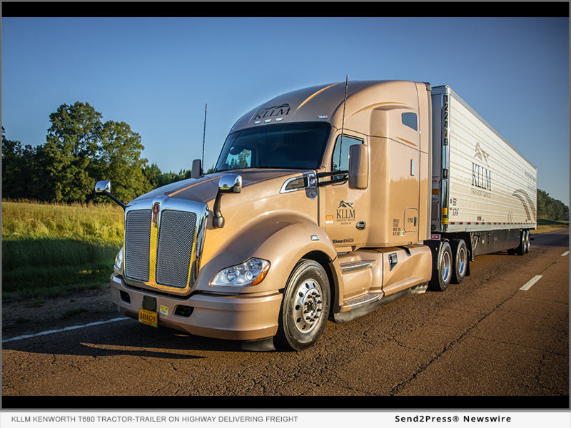 KLLM Kenworth T680 tractor-trailer on highway delivering freight