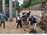 Volunteers participate in a clean-up project led by Alfu Gano, Sustainable Africa Future, The Gambia