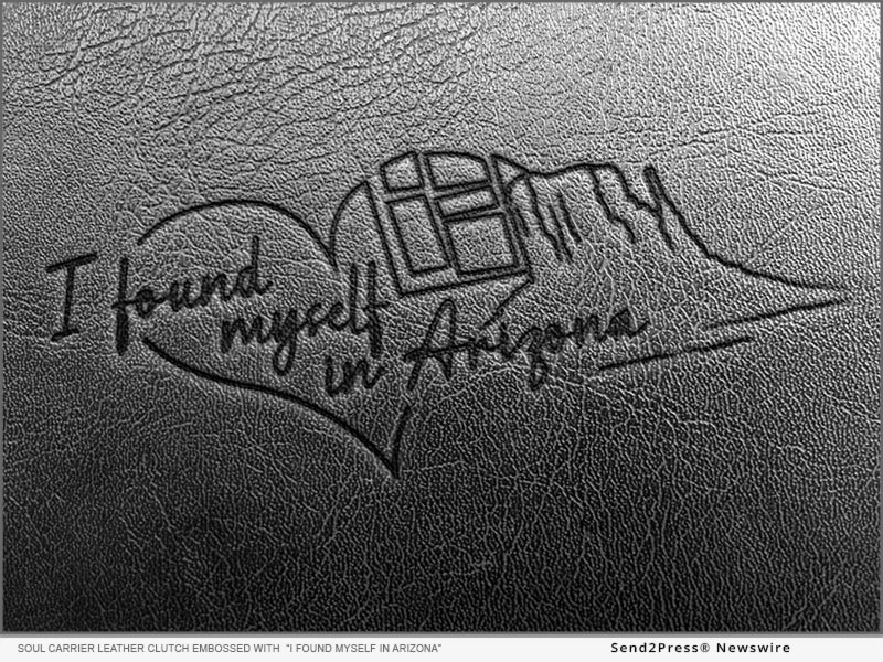 New leather clutch inner pocket debossed illustration reads, I Found Myself in Arizona