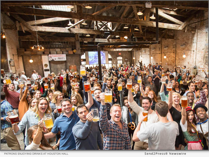 Patrons enjoying drinks at Houston Hall