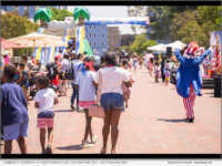 Community members don their red, white, and blue for the annual Independence Day celebration on L. Ron Hubbard Way