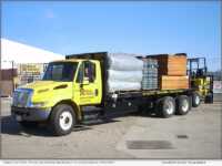 Fence Factory truck delivering materials to a residential property