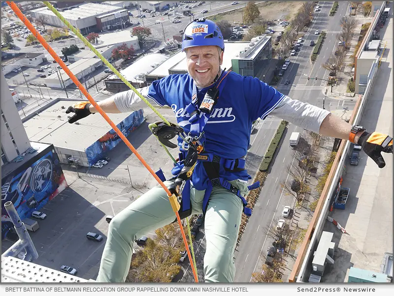 Brett Battina of Beltmann Relocation Group rappelling down the Omni Nashville Hotel.