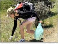 Karin Kiser picking up trash on the Camino