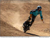 Race winner Joshua Fagerness carves a berm on his KingSong F18 electric unicycle at Let It Ride 5, Boulder City, Nevada, March 29, 2026. Fagerness claimed his first USA EUC National Championship Circuit victory of the 2026 season. Photo credit: Seth Johnson / Amped Electric Games.